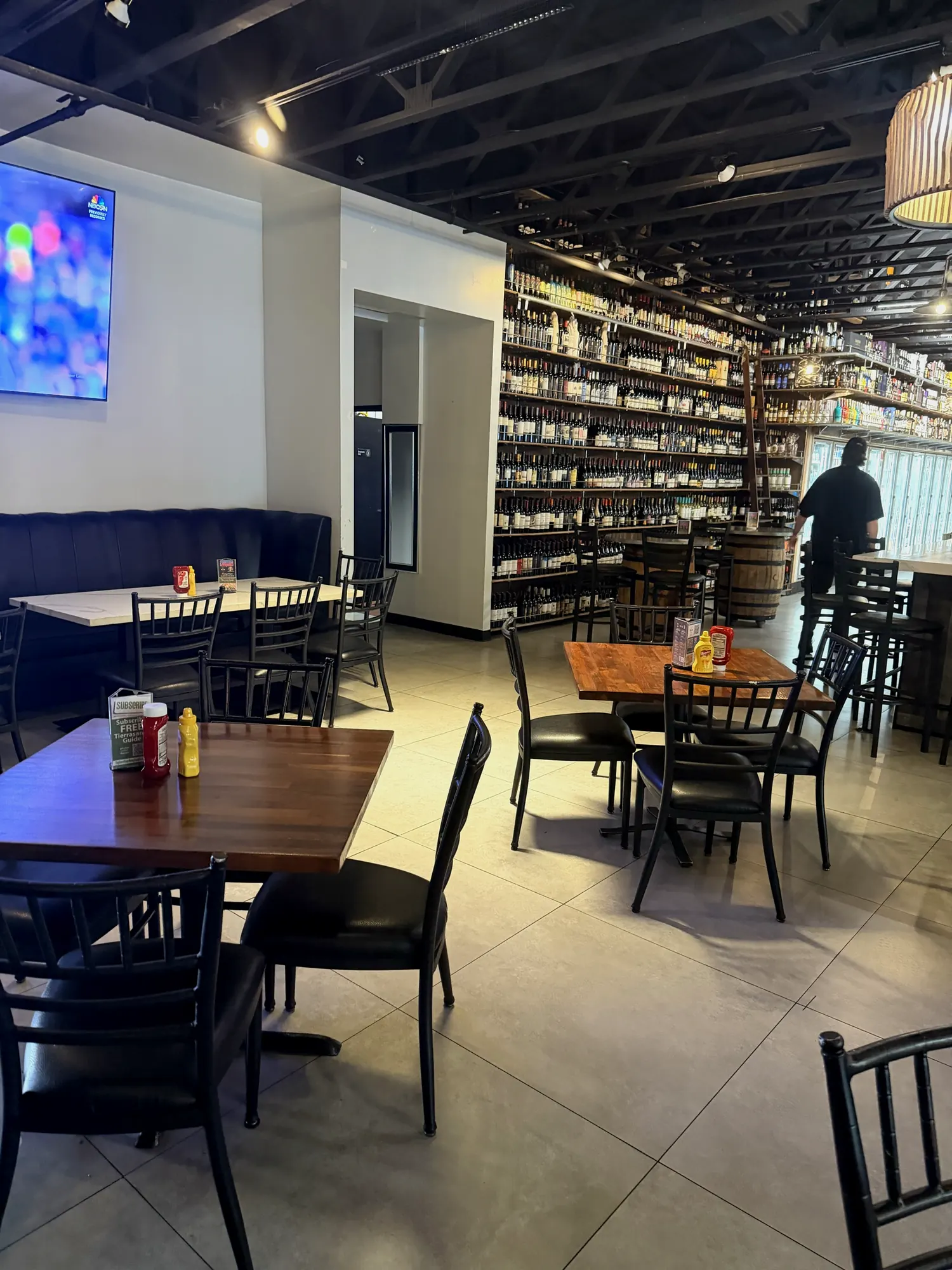 Floor-to-ceiling shelves of wine and spirits in the bottle shop